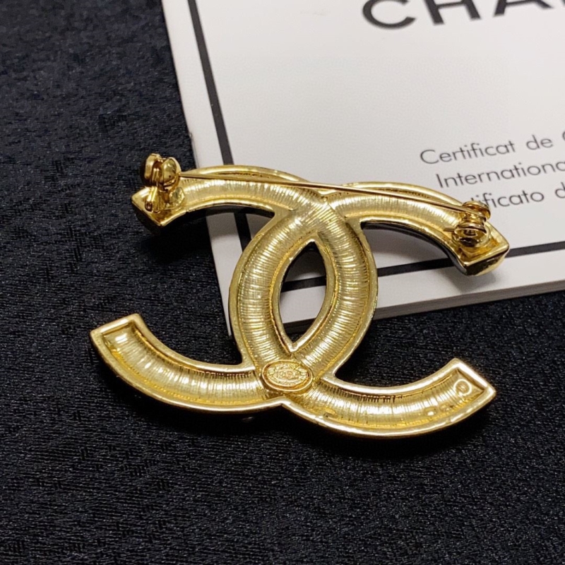 Ch**el brooches